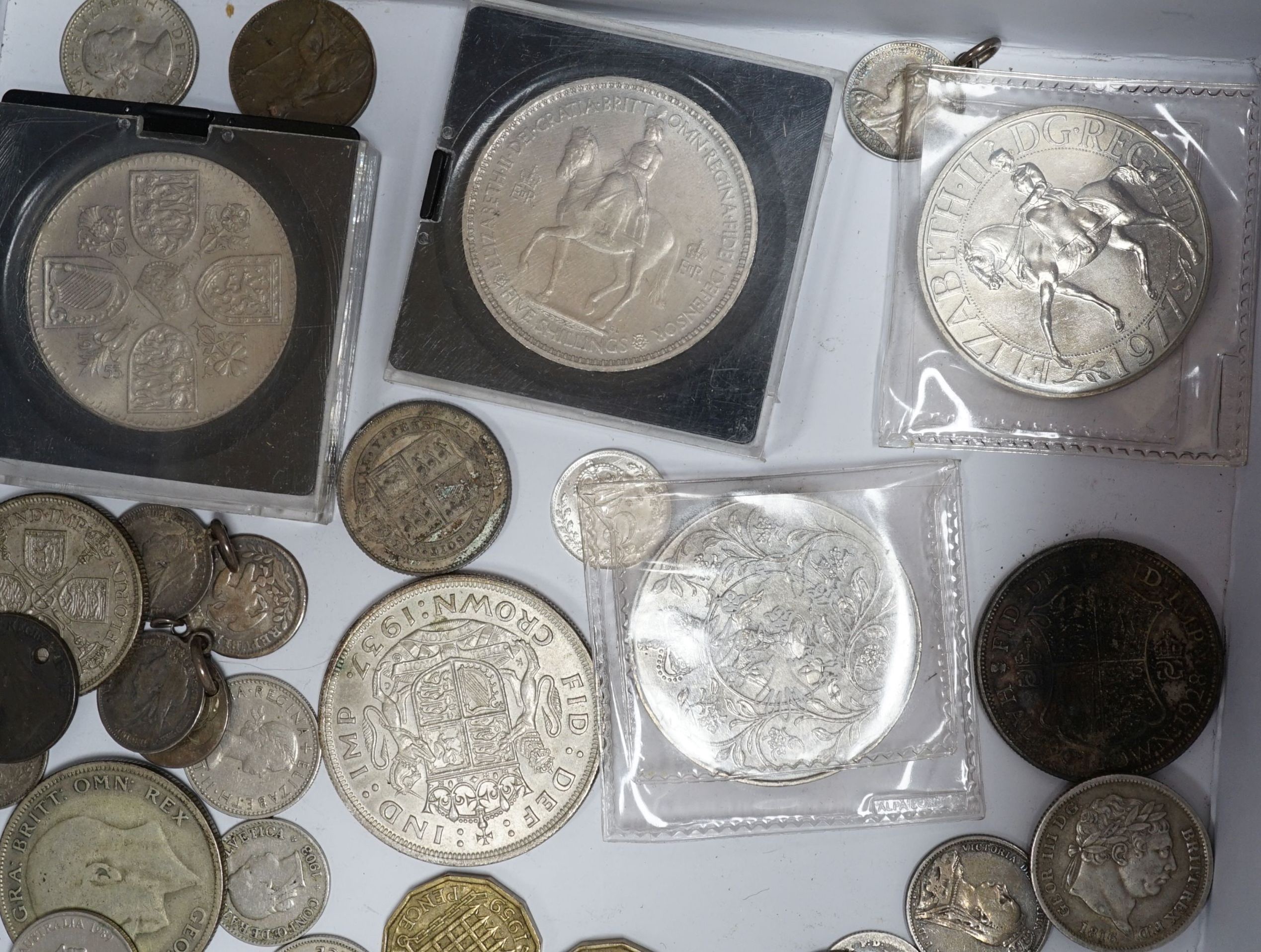 A group of UK coins including 1819, 1821 and 1891 crowns, two 1887 half crowns, 1887 florin, etc.